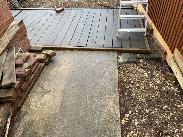 Before image of driveway and decking