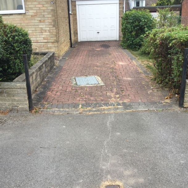Before image of block paving driveway