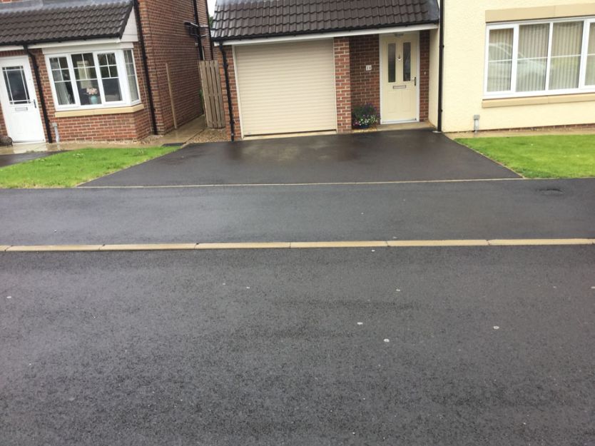 Before image of a tarmac driveway